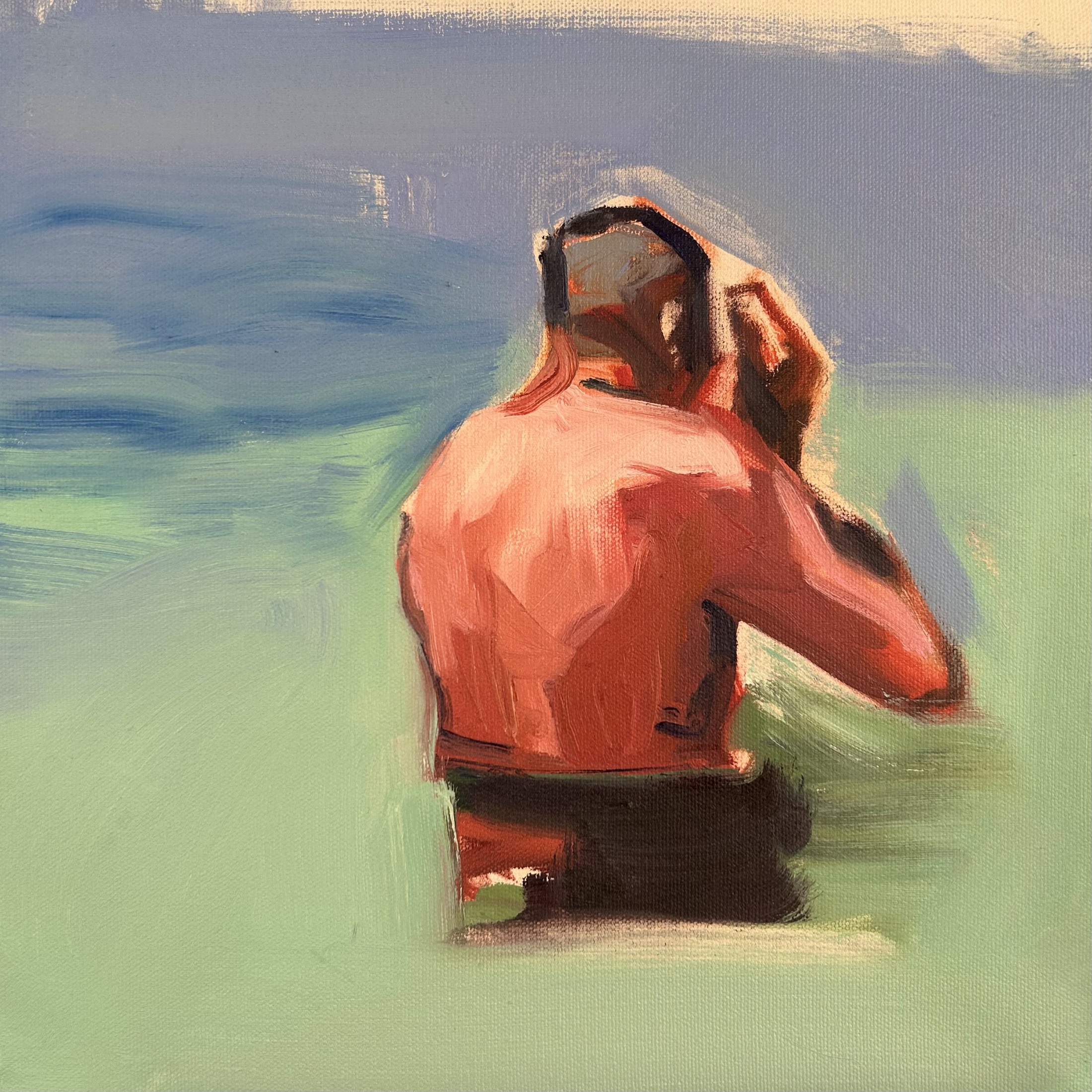 Seated red figure against blue and green water